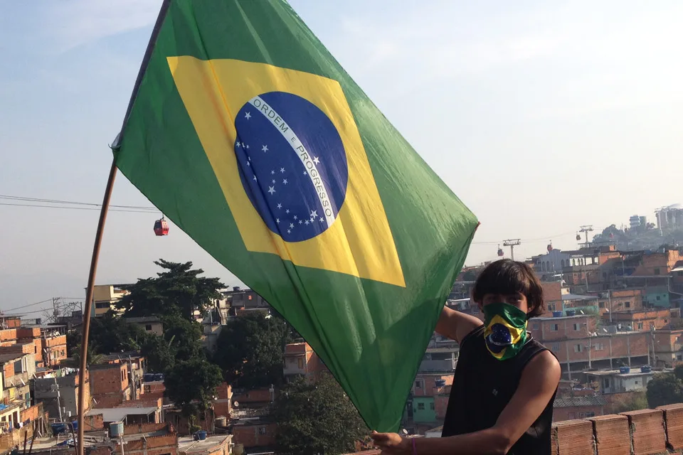 A Brazil flag flies over Complexo de Alemão