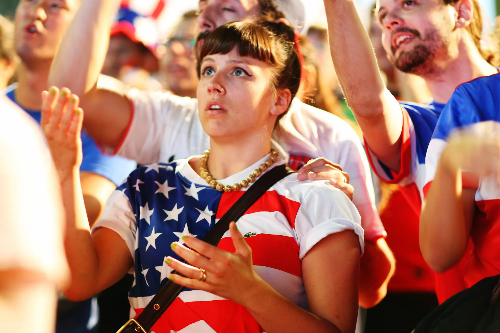 A girl reacts in disbelief as the USA team miss an opportunity to score