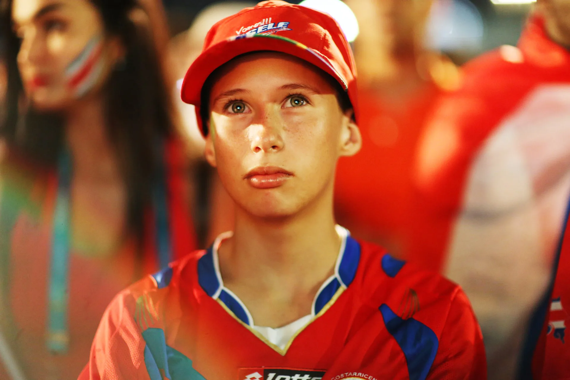 Joris from Costa Rica watches the 1st round World Cup action with his dad in the FIFA fan zon