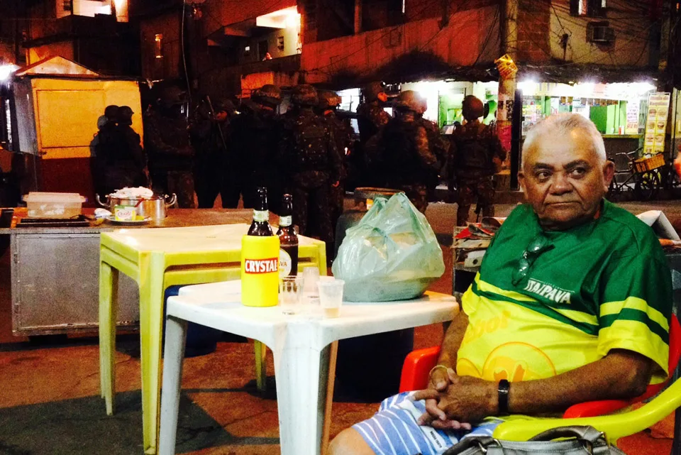 Seu João watches the game